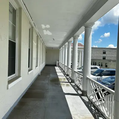 Porch on south side of 1889 building looking east toward the side entrance.