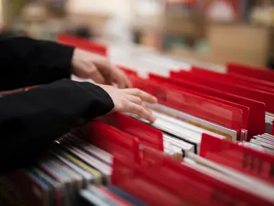 close up hands looking through file folders
