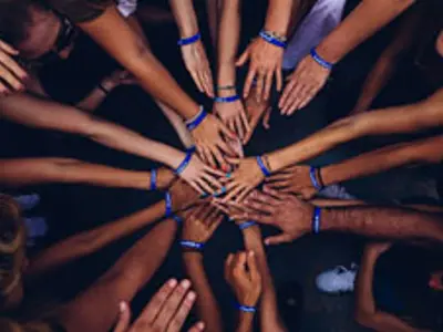 image of hands in the center of a circle