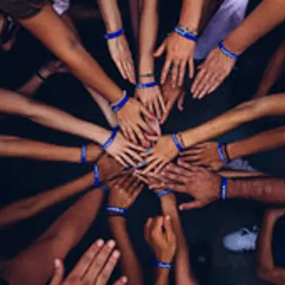 image of hands in the center of a circle
