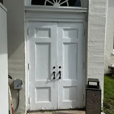 South side at grade entry doors to chapel.