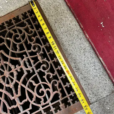 Floor grate in chapel.