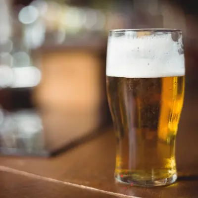 image of beer in a glass on a counter