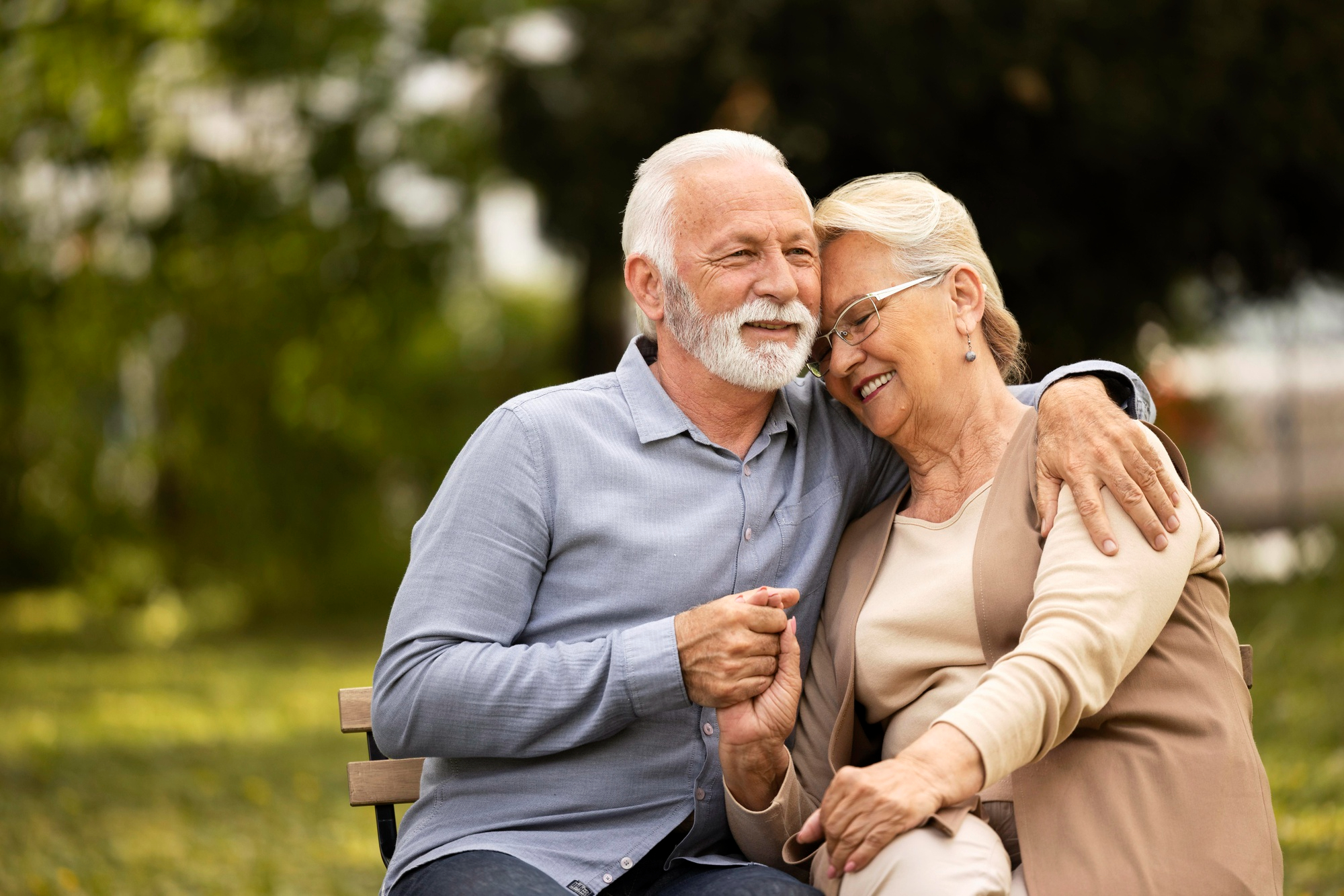 senior couple sitting on a bench