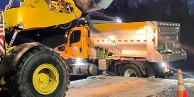 highway truck being loaded with salt