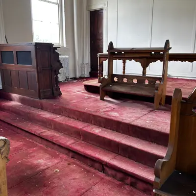Elevated altar area in chapel.