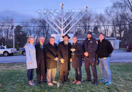 Yorktown Town Board officials and Town employees stand with Rabbi Yehuda Heber at Yorktown’s annual menorah lighting ceremony.
