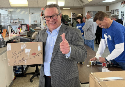 Yorktown Supervisor Tom Diana holds the 30,000th care package prepared by United for the Troops on March 5, 2023.