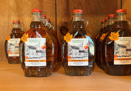 Image of White Oak Farm maple syrup bottles.