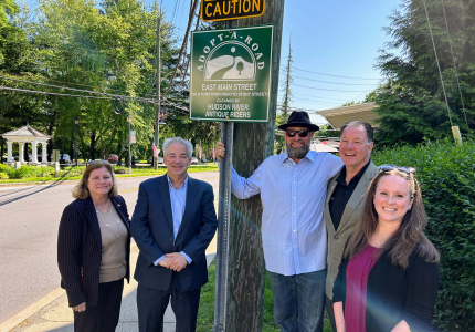 Photo of sign unveiling