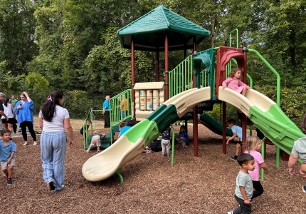Children play on the new jungle gym at the Blackberry Woods playground on Sept. 10, 2025.