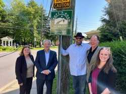 Photo of sign unveiling