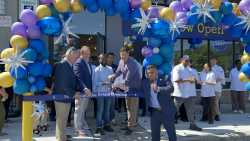 Paris Baguette CEO Darren Tipton cuts a ribbon at his company's new bakery in Yorktown Heights on August 8, 2025. 